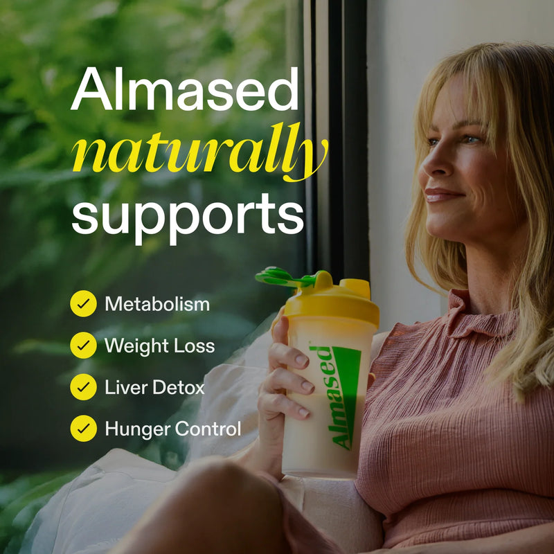 A woman sitting by a window holds a white and yellow Almased shaker cup. Large text on the left reads 'Almased naturally supports' with bullet points listing Metabolism, Weight Loss, Liver Detox, and Hunger Control.